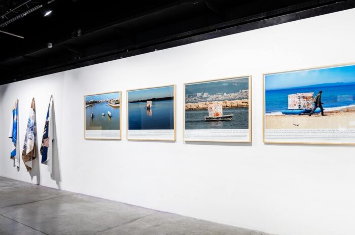 Katrin Ströbel & Mohammed Laouli frontières fluides : La Méditerranée comme vous l’aimez (Euro Ice Cream, la Méditerranée, Café Schengen), 2018 3 photographies sur bâche PVC, dimensions variables. frontières fluides : Transit (ion) #1, Tansit (ion) #2, Tansit (ion) #3, Tansit (ion) #4, 2018 Photographies en grand format, tirages numériques sur papier coton 270g, 104 x 180cm. Courtesy des artistes et de l’adagp, Paris, 2026. © La Condition Publique & Le Cube - independent art room photo: Frédéric IOVINO